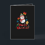 Cartes Pour Fêtes Annuelles Merry Christmas!<br><div class="desc">This cheerful Christmas illustration features an adorable snowman wearing a hat and scarf against a solid black background. Surrounded by bells,  snowflakes,  and a gingerbread man,  the image highlights the bold red and green greeting "Merry Christmas!" at the bottom,  making it a vibrant and sweet seasonal design.</div>