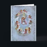 Cartes Pour Fêtes Annuelles Noël Vintage - Bébé Jésus entouré d'anges,<br><div class="desc">Une image vintage de la carte de Noël sur un arrière - plan bleu pâle présente un cercle de petits anges adorables entourant une enfant comme Marie et le bébé Jésus. Les anges flottent sur les nuages tandis qu'un cercle extérieur d'étoiles borde la carte. Le message à l'intérieur de la...</div>