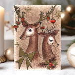 Cartes Pour Fêtes Annuelles Noël Vintage Buck And Doe Deer<br><div class="desc">Carte Vintage De Fêtes De Noël De Buck And Doe Deer. Ce dessin est composé d'un buck et d'un cerf de Noël orné de décorations de Noël accrochées à leurs bois. Quelle belle scène de vacances rétro. Personnalisez ce design personnalisé avec votre propre salutation intérieure.</div>
