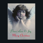 Cartes Pour Fêtes Annuelles Peace, love et joy. Vintage Christmas Angel<br><div class="desc">Beautiful vintage design of a peaceful Christmas angel with soft white wings and rosy cheeks, holding her face in her hands. La fuite de la pédophilie et de l'enfant. The background is filled with soft ethereal clouds. text reads peace. love nad joy. Merry Christmas. A customizable message and familiy name...</div>