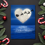 Cartes Pour Fêtes Annuelles Père Noël and Heart Pleine lune Beach Noël<br><div class="desc">Cette carte de voeux Joyeux Noël présente une pleine lune en forme de coeur avec Père Noël et son traîneau au-dessus d'un plan d'eau éclairé par la lune. Salutation intérieure ~ "Wishing you a Magical Holiday Season". Le salut peut être personnalisé pour lire comme vous le souhaitez. ^</div>