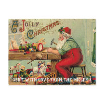 Père Noël dans son atelier fabriquant des jouets C