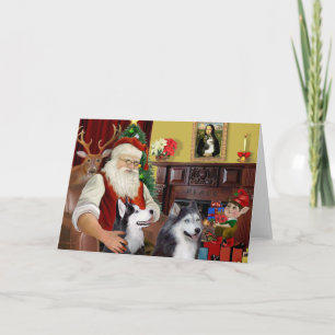 Cartes Pour Fêtes Annuelles Père Noël de deux Huskies sibériens