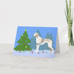 Cartes Pour Fêtes Annuelles Saluki décorant un sapin de Noël dans la forêt