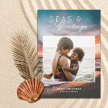 Cartes Pour Fêtes Annuelles Seas and Greetings Beach Sunset Painting Photo<br><div class="desc">These beautiful holiday photo cards feature a beach sunset painting in the background and a rectangular (almost square) photo template. Stylish, modern typography reads, "Seas & Greetings." Easy to personalize. The back is dark teal blue - Leave as is or customize the color, if desired. Add more photos to the...</div>