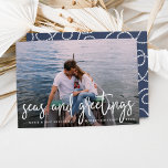 Cartes Pour Fêtes Annuelles Seas and Greetings | Nautical Holiday Photo Card<br><div class="desc">Send holiday greetings to friends and family in nautical style with these coastal chic holiday photo cards. Design features your favorite photo with "seas and greetings" overlaid in crisp white hand sketched lettering. Personalize with your names, custom greeting (shown with "Merry Christmas") and the year. Cards reverse to a white...</div>