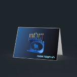 Cartes Pour Fêtes Annuelles Shiny Blue Chanukkah Menorah<br><div class="desc">A modernistic,  metallic,  blue Chanukkah menorah,  featuring a lion in silhouette,  against a dark,  night-like background. All nine of the candles are lit. Hebrew text reading "Chag Chanukkah Sameach" (Happy Hanukkah) also appears in glowing blue and white.</div>