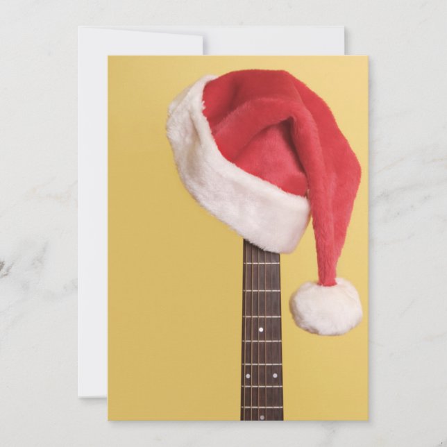 Cartes Pour Fêtes Annuelles Un casquette de Père Noël accroche sur une guitare (Devant)