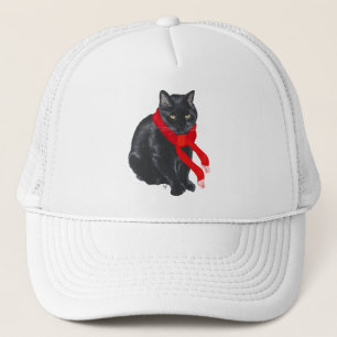 Casquette Chat noir se réchauffant à Noël