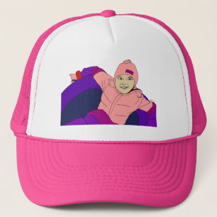 Casquette Fille faisant du tubing dans la neige