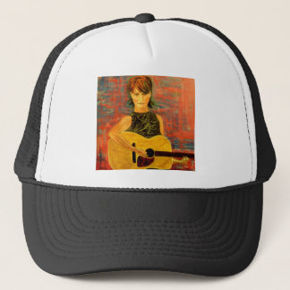 Casquette fille jouant de la guitare acoustique