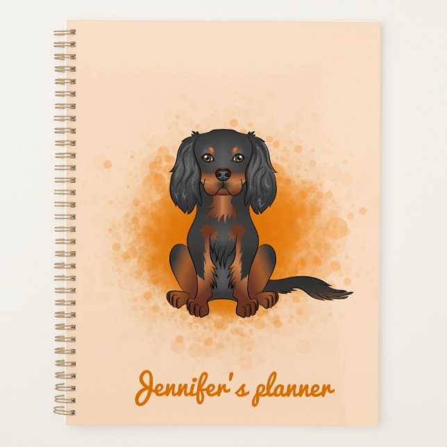 Cavalier King Charles noir et fauve sur fond orang (Devant)