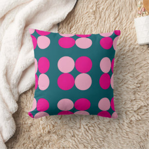 Cercles roses sur un coussin vert
