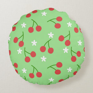 Cerises et Coussin rond de fleurs blanches