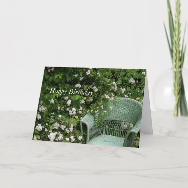 Chaise en osier parmi les fleurs Carte de voeux An (Devant)