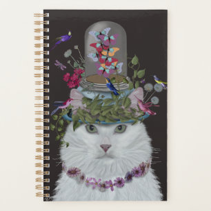 Chat blanc avec cloche papillon