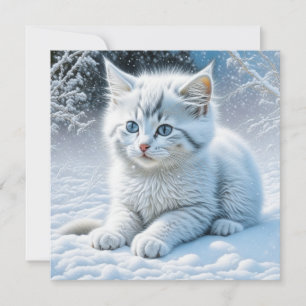 Chat blanc mignon jouant dans la neige