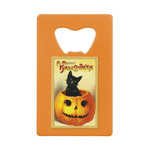 Chat d'Halloween assis dans une citrouille lumineu