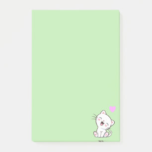Chat mignon et cœur sur des notes Post-it vert cla
