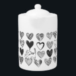 Chat noir et blanc et Motif de coeur<br><div class="desc">Chatte jouant tendu sur un ballon en forme de coeur entouré de différents coeurs à motifs en noir et blanc.</div>