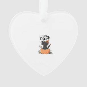 Chat noir mignon dans une citrouille avec un chape