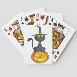 Chat noir sur des cartes de jeu de citrouille