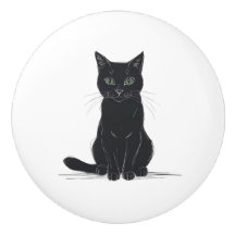 Chat noir sur poignée de porte fond blanc