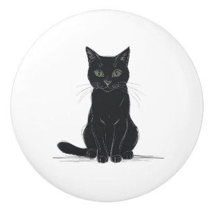 Chat noir sur poignée de porte fond blanc