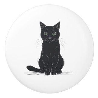 Chat noir sur poignée de porte fond blanc