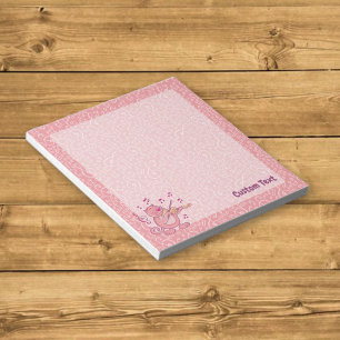 Chat rose avec bloc-notes de violon