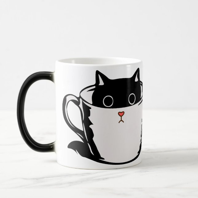 Chaton noir avec nez rouge caché dans une tasse (Gauche)
