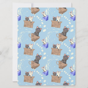 Chats en boîte et gouttes de lait sur bleu