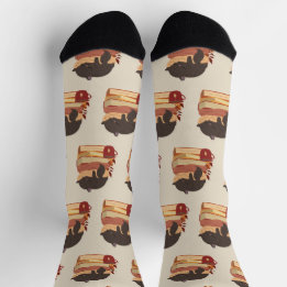 Chaussette A cute kitten sleeping curled up on a pile of book