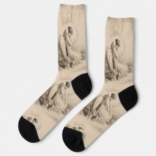 Chaussette Ange chrétien assis sur une pierre