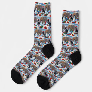 Chaussette Grand Danois courant dans la neige avec un chapeau