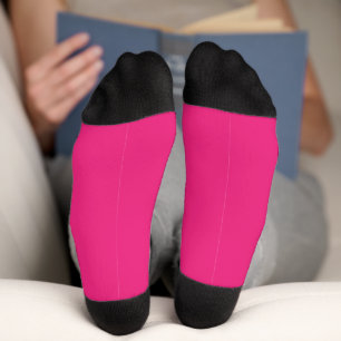 Chaussette un arrière - plan rose avec un noir