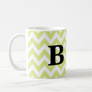 Chaux et tasse noire de monogramme de Chevron