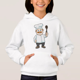 Chef avec casquette et cuillère à soupe du chef