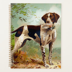 Chien de chasse avec oiseau dans la bouche