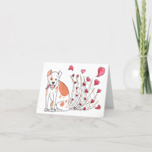Chien heureux avec la carte de Valentine de coeurs