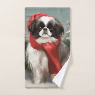 Chien Japonais Chin dans la neige de Noël