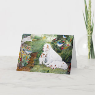 Chiots de Clumber dans la carte de voeux de jardin