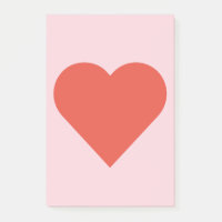 Coeur rouge sur la note de post-it rose d'arrière