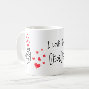 Coeurs de doigt d'amour rouge tasse de café