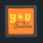 Coffret A Bijoux Vous êtes mon soleil<br><div class="desc">You are my sunshine text design with yellow,  shiny sun decoration. C'est possible to change the background color and to add different one to the design with your choice.</div>