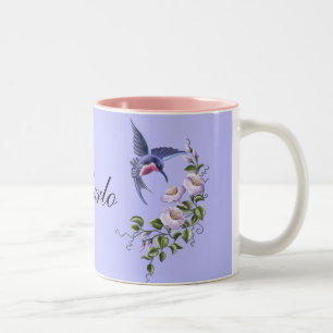 Colibri avec la tasse des fleurs 2