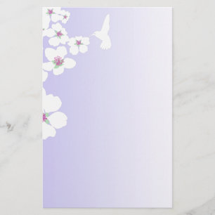 Colibri et fleur sur violet