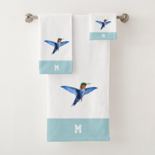 Colibri et monogramme sur fond bleu clair et blanc