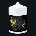 Colibri noir et or<br><div class="desc">Colibris de bijoux en noir et or sur arrière - plan gris décoré de plantes. Bijoux. Oiseau doré. Oiseau d'or.</div>