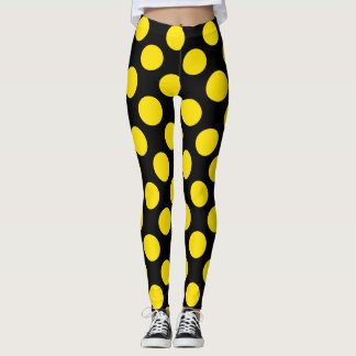 Collants à pois jaunes sur fond noir